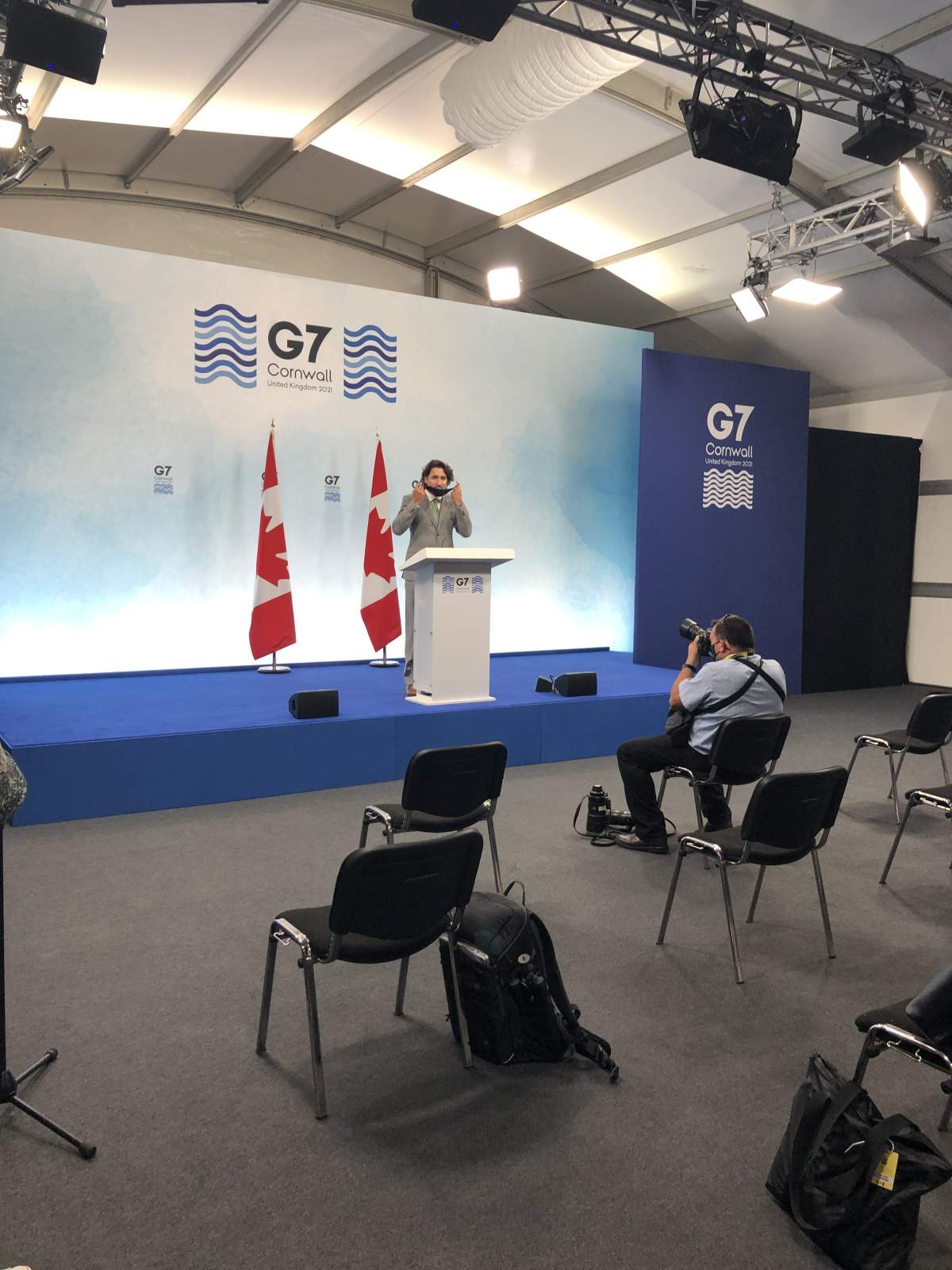 Justin Trudeau removes his mask before speaking at a closing press conference at the G7 in Cornwall, England. June 13, 2021.