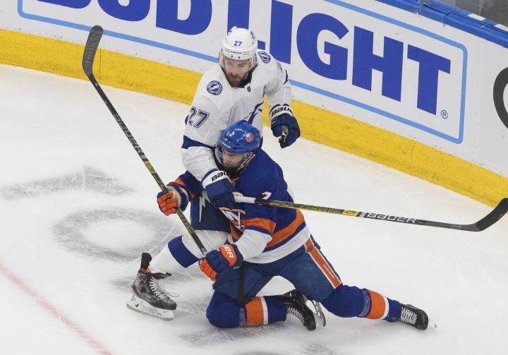 Tampa Bay Lightning defenceman Ryan McDonagh (27) checks New York Islanders right wing Jordan Eberle (7) during first period NHL Eastern Conference final playoff action in Edmonton on Thursday, September 17, 2020.