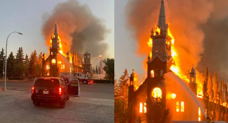 Firefighters in Morinville, Alta. work to extinguish a fire at a St. Jean Baptiste Parish.