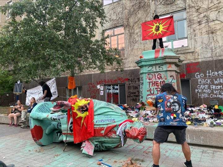 A photo of the Egerton Ryerson statue at Ryerson University in Toronto after being pulled to the ground. Credit: Global News