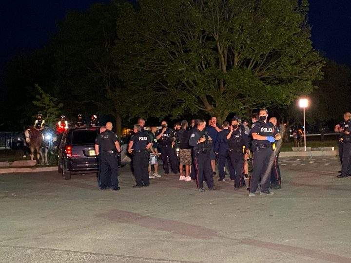 Officers are seen at Ashbridge's Bay Park on Saturday after a stabbing.