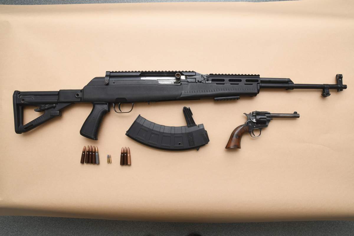 SKS semi-automatic rifle with ammunition and .22 calibre revolver and ammunition.