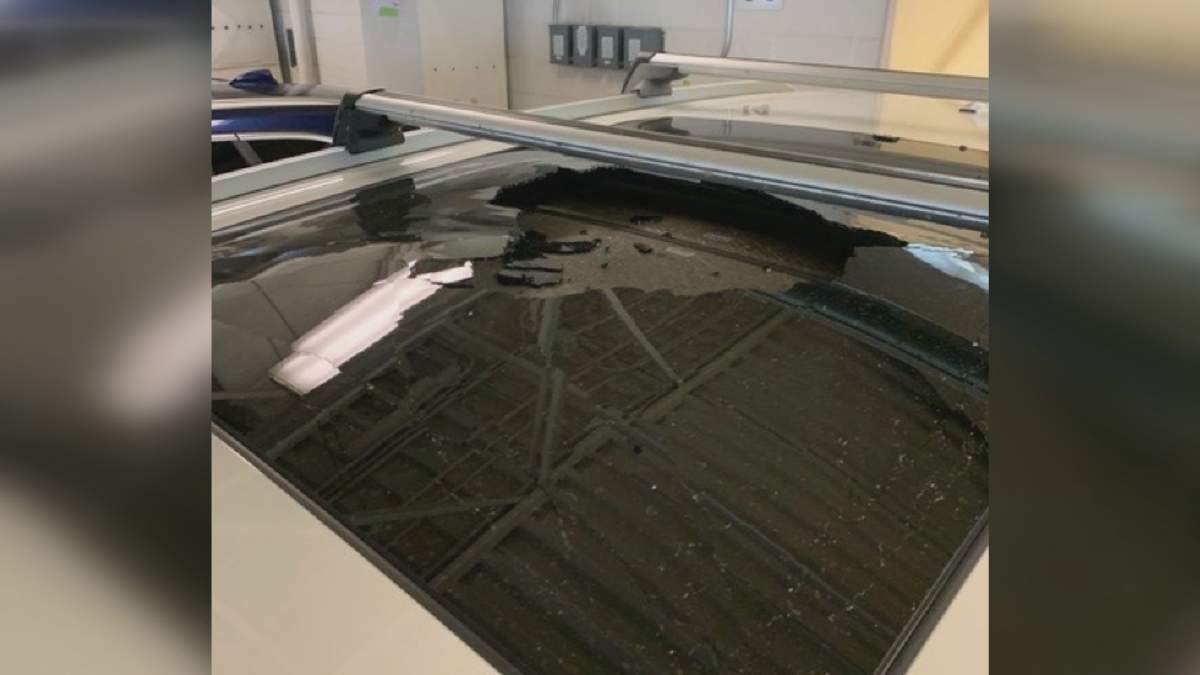 Photo of the large hole left behind in a sunroof that shattered