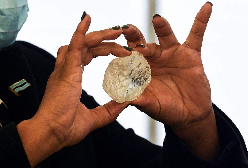 A Botswana member of cabinet holds a gem diamond in Gaborone, Botswana, on June 16, 2021.