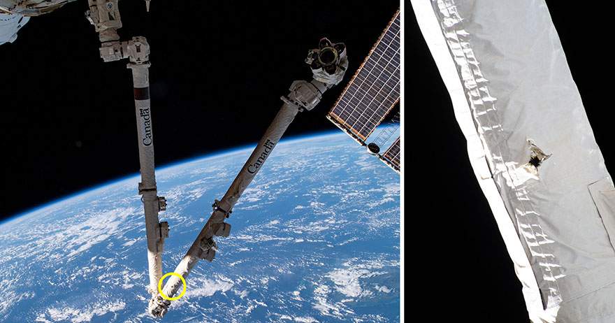 A puncture hole in the Canadarm2 is shown in this handout photo from May 2021.