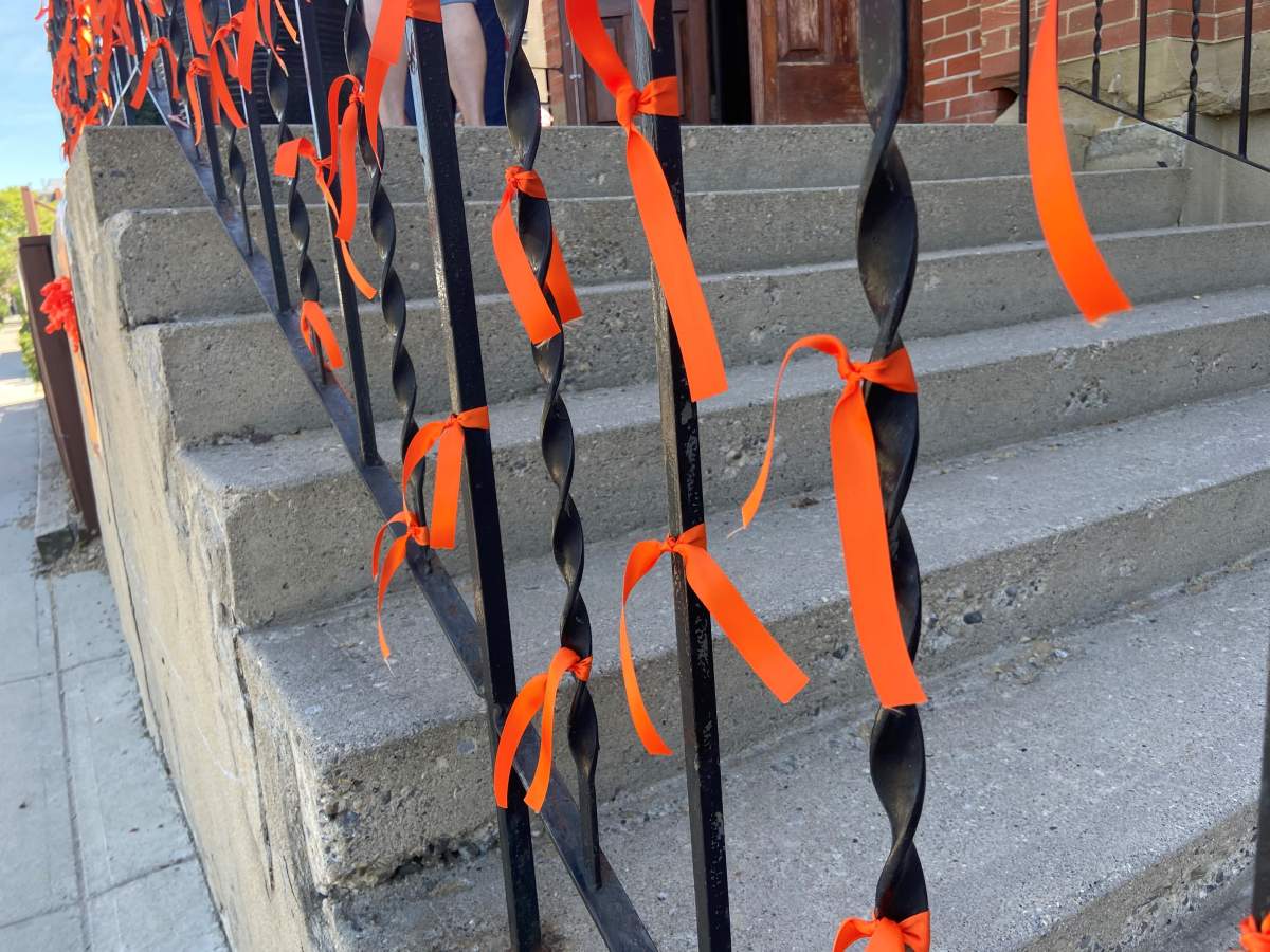 215 orange ribbons are tied outside Hillhurst United.