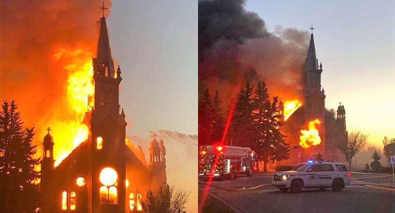 Firefighters in Morinville, Alta. work to extinguish a fire at a St. Jean Baptiste Parish.