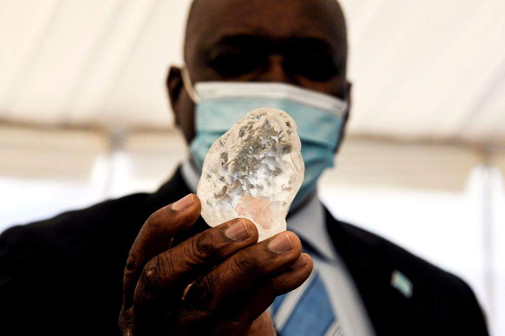 Botswana President Mokgweetsi Masisi holds a gem diamond in Gaborone, Botswana, on June 16, 2021.