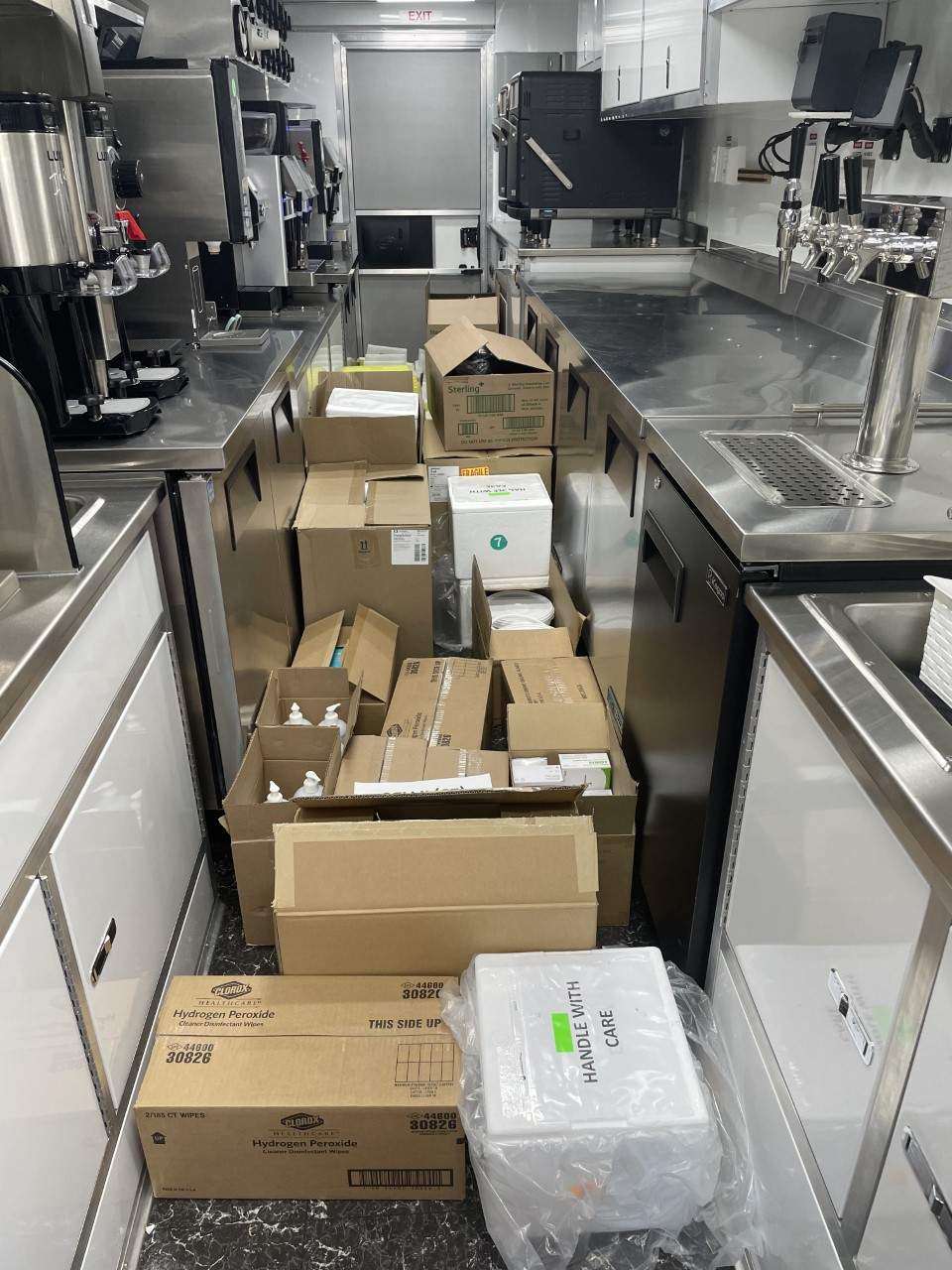 Inside one of Fleets Coffee trucks, showing medical supplies in boxes. The trucks are often transformed into a mobile vaccination clinic–transporting medical supplies and nurses to COVID hot spots in Toronto.