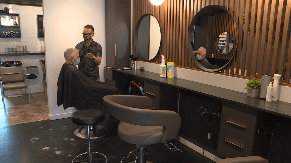Darrell White getting his haircut at Angles Hair Salon Saturday afternoon.