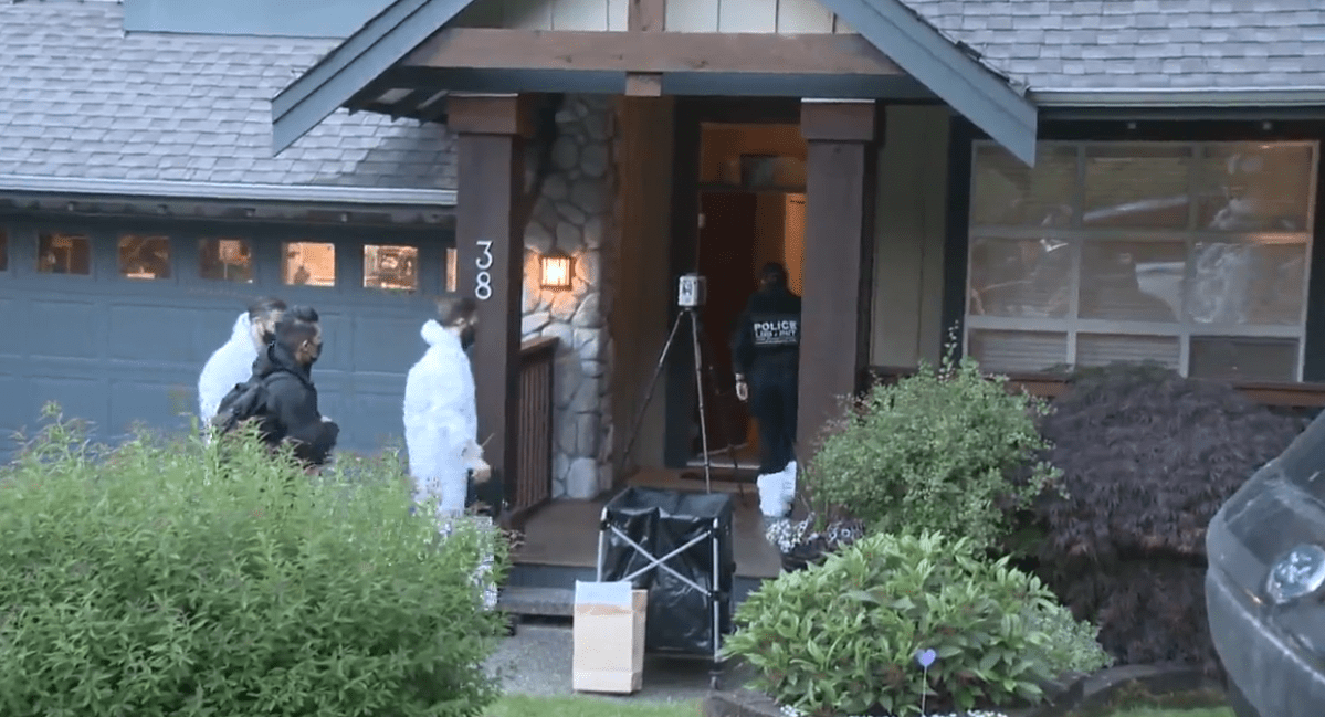 Homicide and forensics investigators enter Trina Hunt's Port Moody home. 