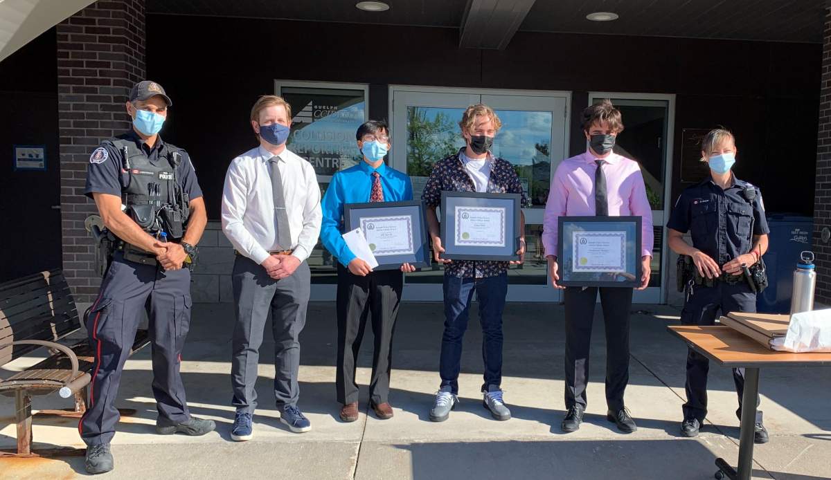 From left, Const. James Nightingale, Centennial CVI vice-principal Chris Fiddes, Bill Nguyen, Simon Slade, Christopher Bangart and Sgt. Angela Grover.