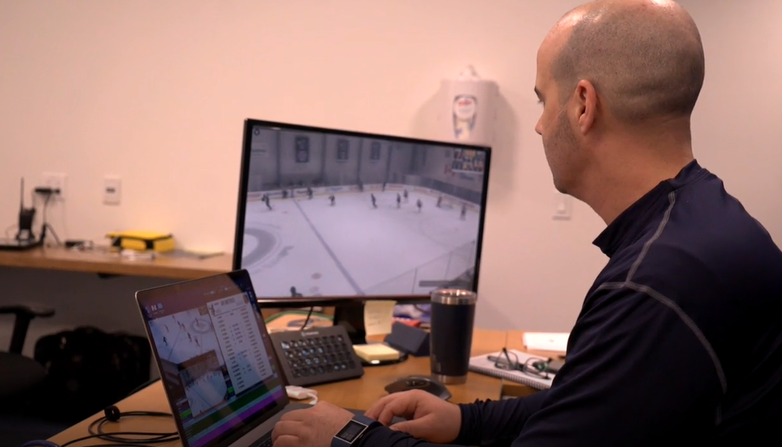 Manitoba Moose video coach Richard Bue reviewing game footage from the 2021 season.