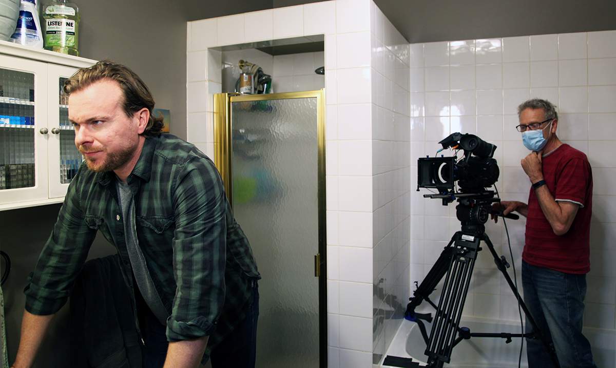 Actor Ry Barrett and director of photographer Gary Elmer on the set of Open Your Eyes.