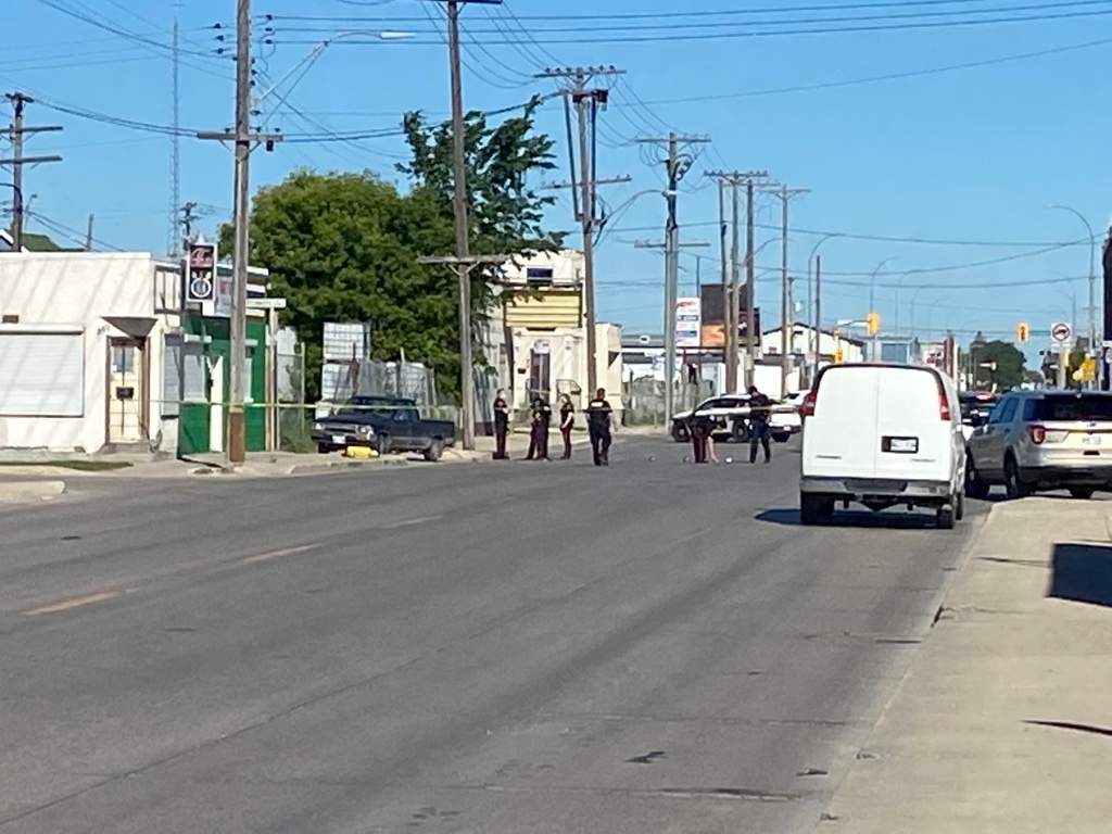 Winnipeg police investigate a hit and run near Logan Avenue and Tecumseh Street Tuesday.