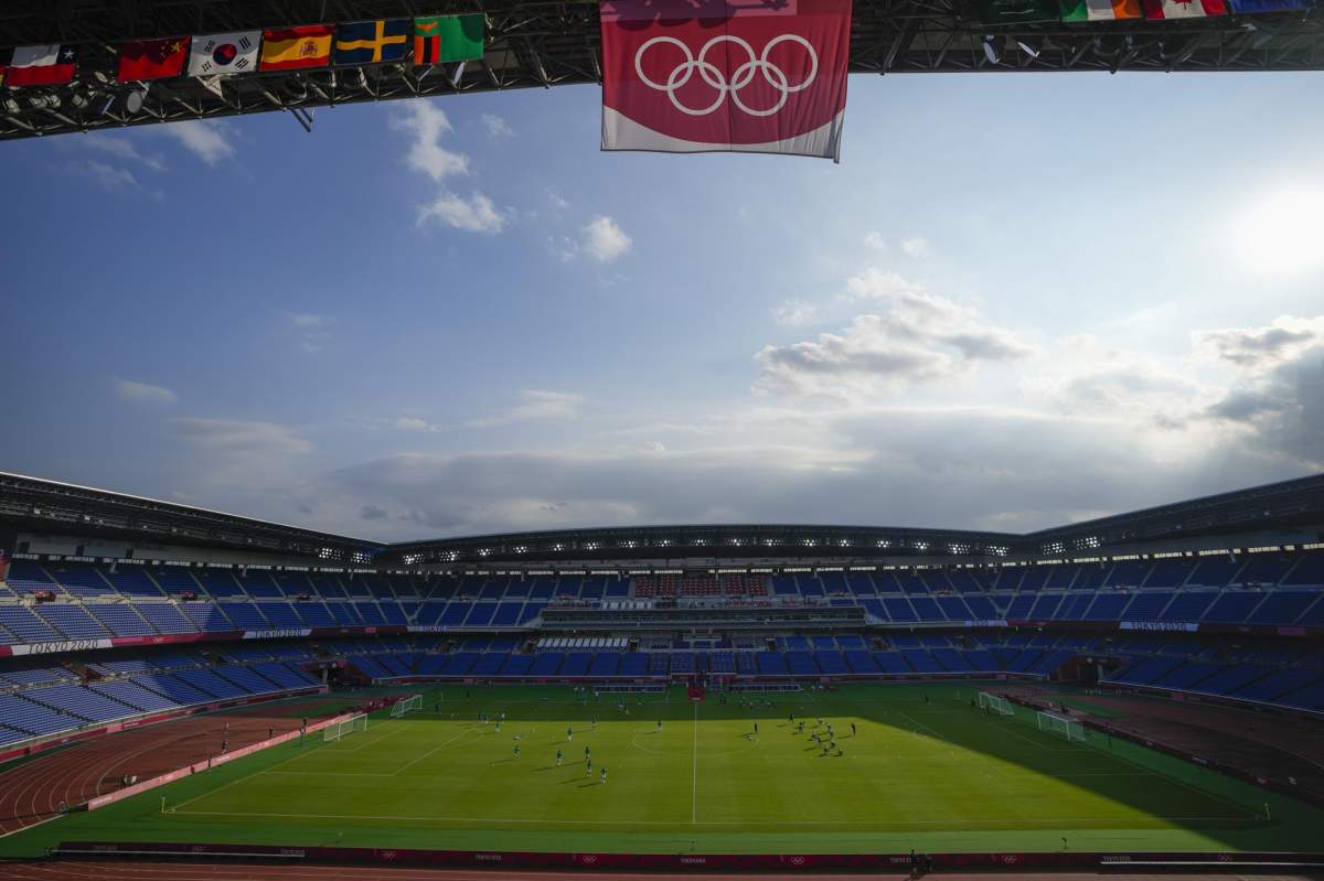 Players of Brazil and Ivory Coast warm up in the International Stadium prior to a men\’s soccer match at the 2020 Summer Olympics, July 25, 2021, in Yokohama, Japan.