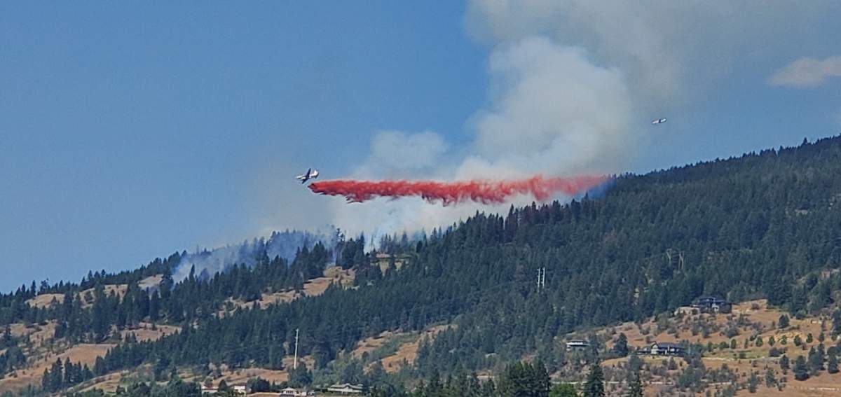 A photo of an air tanker dropping retardant on the Becker Lake wildfire just east of Vernon on Saturday afternoon.