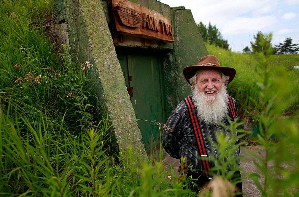 Bruce Beach poses for a photo in front of his fallout shelter in Horning's Mills on July 9, 2015. 