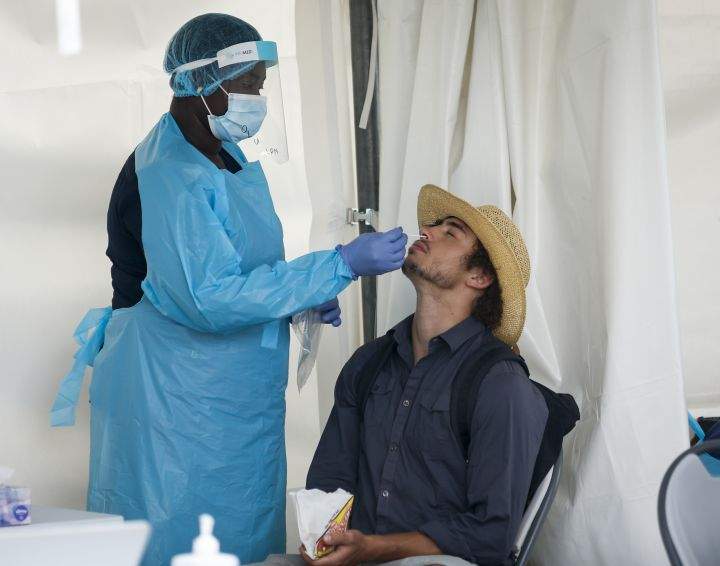 A visitor to Nashville North has a rapid COVID test at the Calgary Stampede in Calgary, Friday, July 9, 2021.