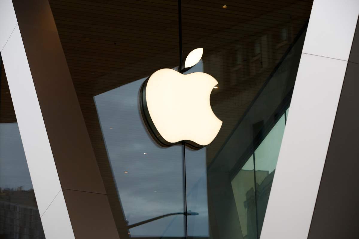 FILE – In this Saturday, March 14, 2020 file photo, an Apple logo adorns the facade of the downtown Brooklyn Apple store in New York.