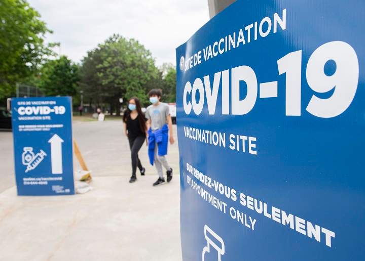 People are shown after receiving a COVID-19 vaccine shot at the Bill Durnan COVID-19 vaccination site in Montreal, Saturday, May 22, 2021, as the COVID-19 pandemic continues in Canada and around the world. 