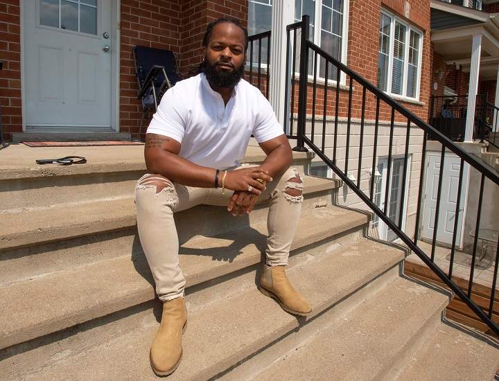 Leslie Blot, who has won another successful racial profiling complaint against the city of Repentigny, is seen in front of his home Monday, July 5, 2021 in Mascouche, Que. 