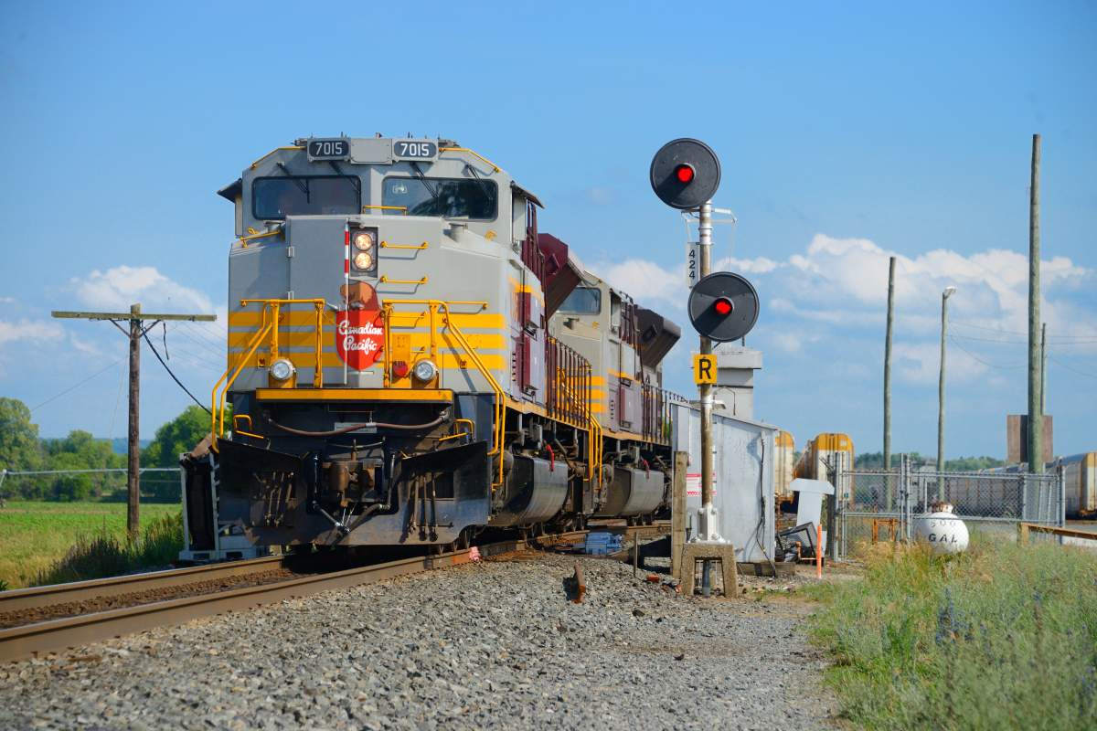 While CN and CP battle for KCS, a pair of heritage painted Canadian Pacific Railway locomotives work a yard with a vintage non PTC compliant stop signal near Alliston Ont., June 26, 2021. 