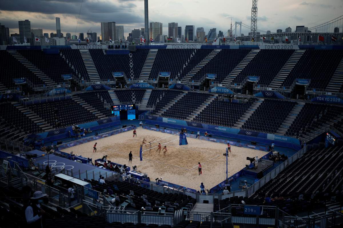 Julia Sude and Karla Borger, of Germany, play against Anouk Verge-Depre and Joana Heidrich, of Switzerland, during a women’s beach volleyball match in the empty Shiokaze Park at the 2020 Summer Olympics, Saturday, July 24, 2021, in Tokyo, Japan.