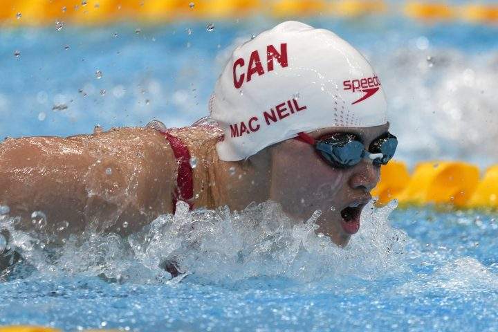 Margaret Mac Neil, of Canada, swims in a heat for the women’s 100-meter butterfly at the 2020 Summer Olympics, Saturday, July 24, 2021, in Tokyo, Japan.