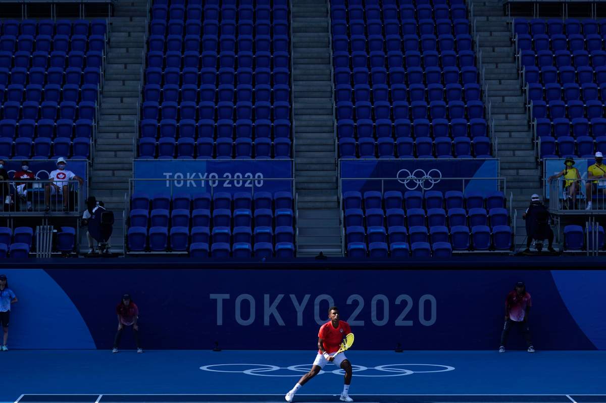 Felix Auger-Aliassime, of Canada, plays against Max Purcell, of Australia, during the first round of the tennis competition at the 2020 Summer Olympics, July 25, 2021, in Tokyo, Japan.