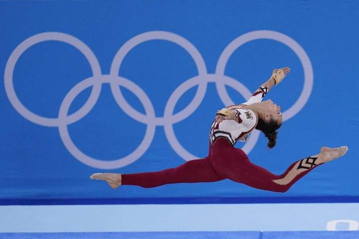 Pauline Schaefer-Betz, of Germany, performs her floor exercise routine during the women’s artistic gymnastic qualifications at the 2020 Summer Olympics, Sunday, July 25, 2021, in Tokyo.