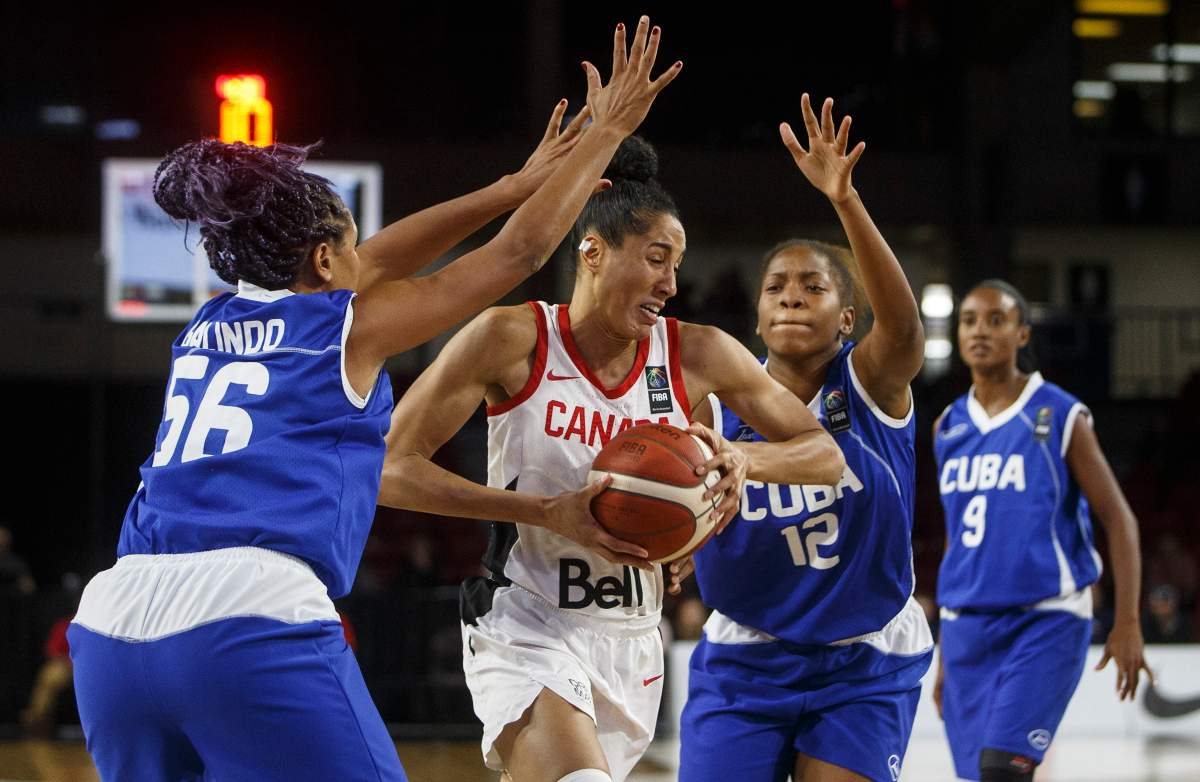 Canada’s Miranda Ayim (9) tries to get through Cuba’s Anisleidy Galindo (56) and Nahomis Vargas (12) during second-half action of FIBA Women’s Olympic Pre Qualifying Tournaments Americas 2019, in Edmonton on Thursday, Nov. 14, 2019. THE CANADIAN PRESS/Jason Franson