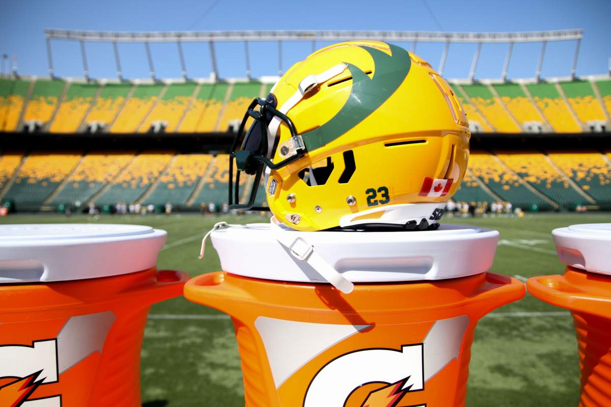 Edmonton Elks helmet with Commonwealth Stadium in the background.