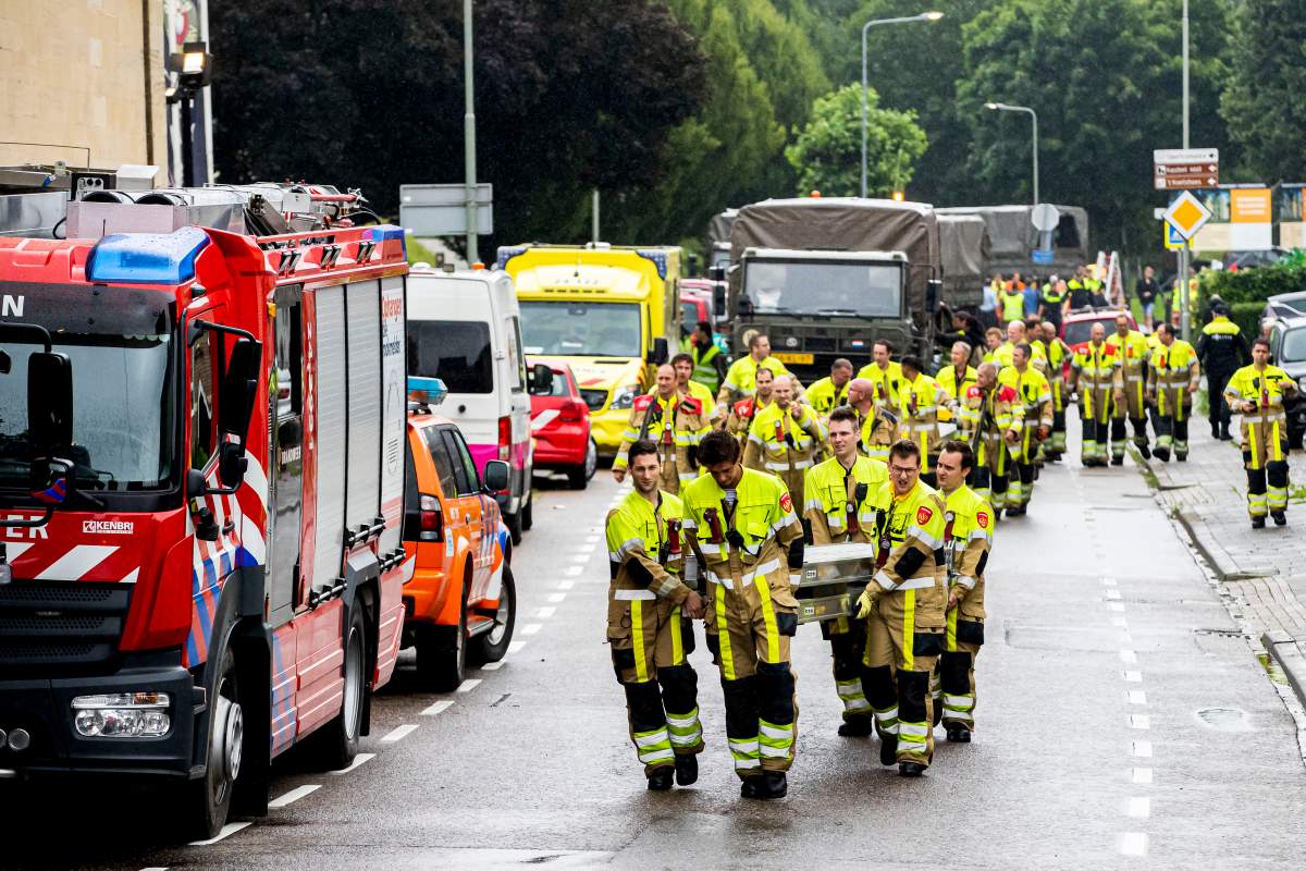 Firefighters are seen helping to evacuate residents on July 15, 2021 in Valkenburg, Netherlands. The south of Limburg was hit by extremely high water levels on Thursday as a result of the heavy rainfall in recent days. Streets and houses were flooded and villages had to be evacuated because of the flooding.