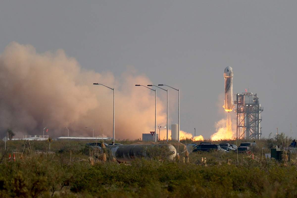 The New Shepard Blue Origin rocket lifts-off from the launch pad carrying Jeff Bezos along with his brother Mark Bezos, 18-year-old Oliver Daemen, and 82-year-old Wally Funk prepare to launch on July 20, 2021 in Van Horn, Texas. Mr. Bezos and the crew rode in the first human spaceflight for the company.