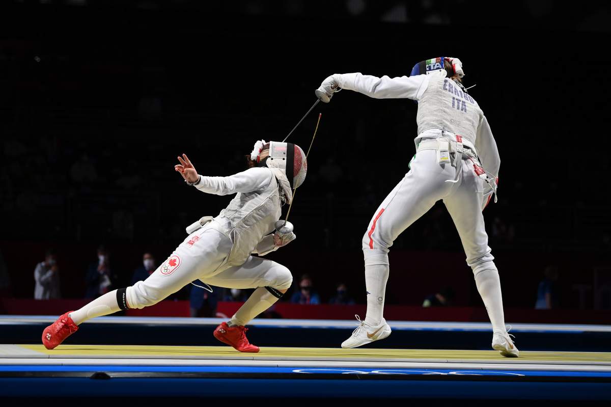 Arianna Errigo of Team Italy, right, competes against Jessica Zi Jia Guo of Team Canada in Women\’s Individual Foil third round on day two of the Tokyo 2020 Olympic Games at Makuhari Messe Hall on July 25, 2021 in Chiba, Japan.