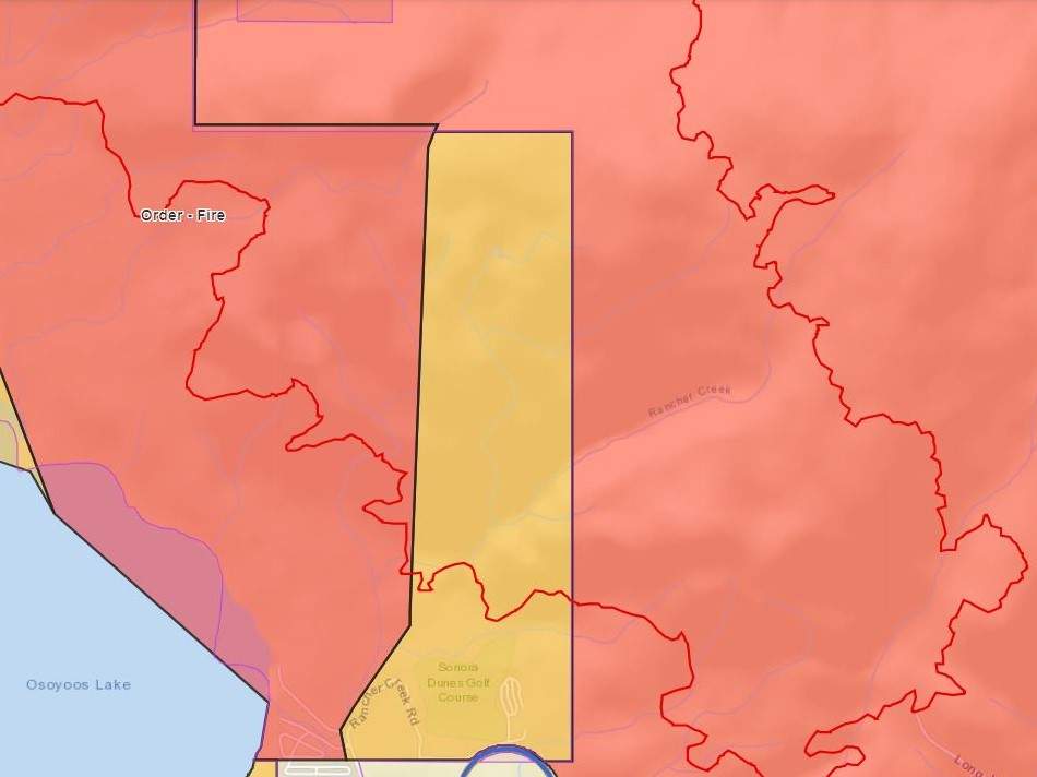 A map showing a slice of opposing colour, indicating where an evacuation order for the Nk’Mip Creek wildfire near Osoyoos has been replaced by an evacuation alert. As of Saturday morning, the fire near Osoyoos was listed at 6,800 hectares, the same size it was on Friday.