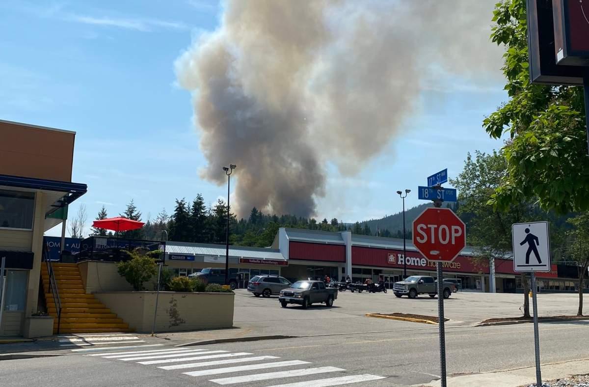 Smoke is seen rising from the Merry Creek fire near Castlegar on Thursday.