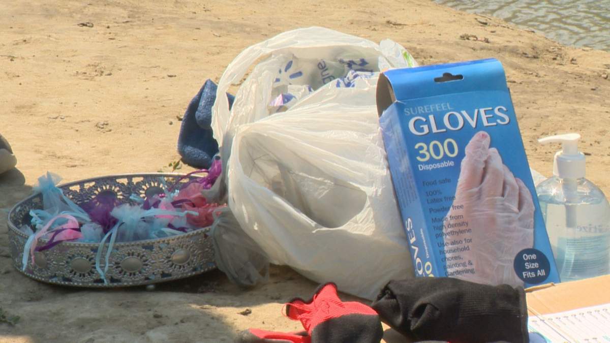 Mermaid Zenevieva brought gloves, hand sanitizer and gifts for people who took part in the Shoreline Cleanup.