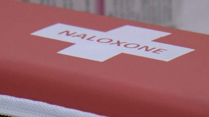 A naloxone injection kit is seen.
