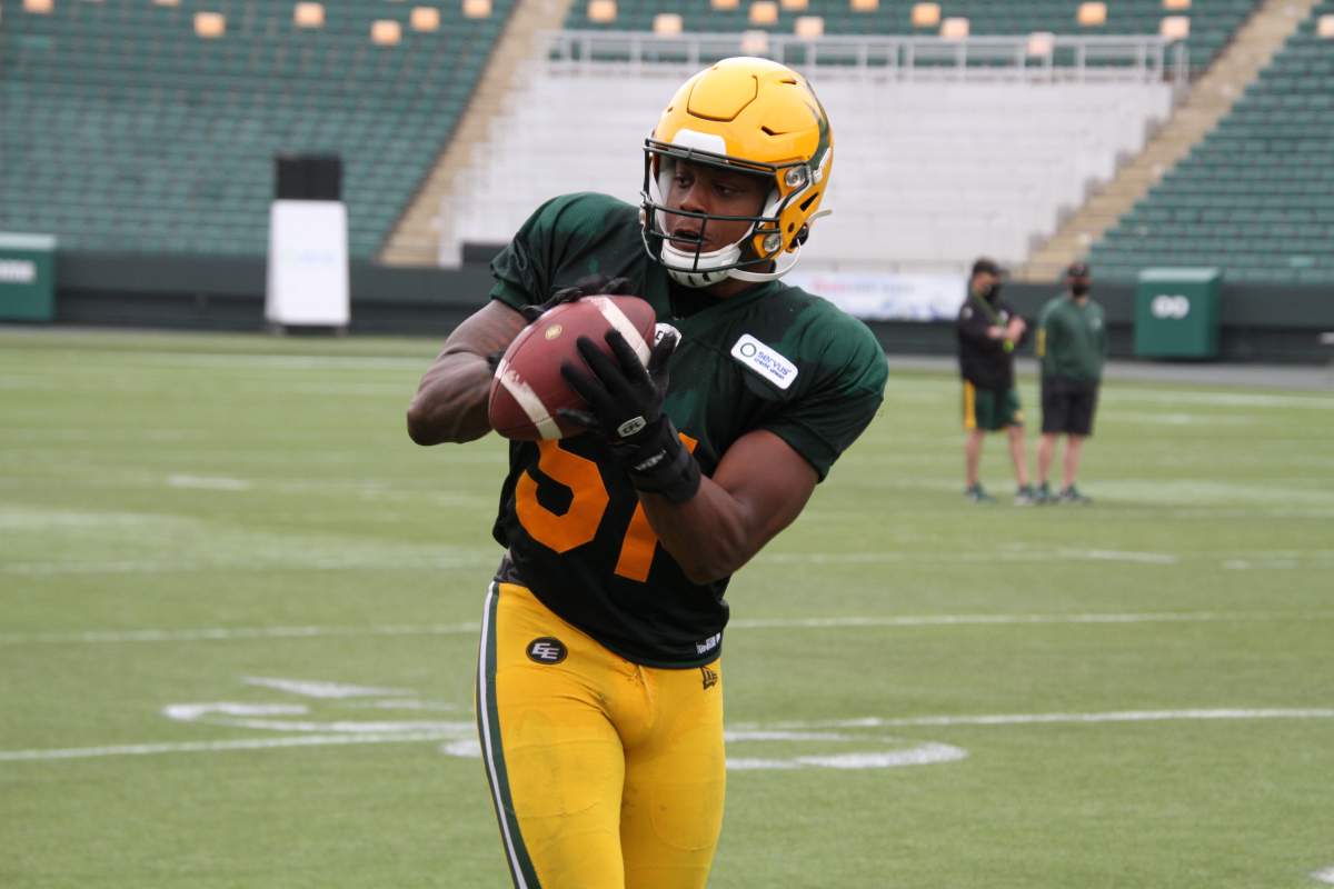 Edmonton Elks linebacker Nyle Morgan with the football during 2021 training camp.