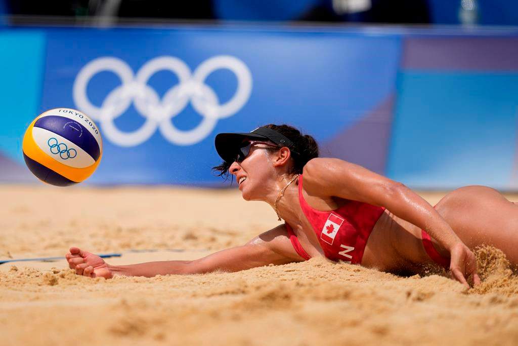 Melissa Humana-Paredes, of Canada digs out the ball during a women’s beach volleyball match against Spain at the 2020 Summer Olympics, Monday, Aug. 2, 2021, in Tokyo, Japan. (AP Photo/Petros Giannakouris)