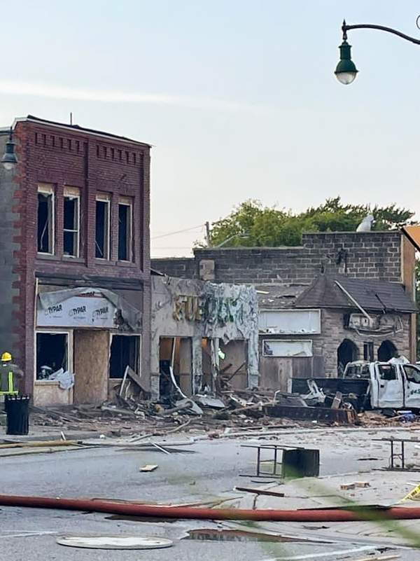 Damaged buildings across the street from the scene of the explosion in Wheatley, Ont., Aug. 26, 2021