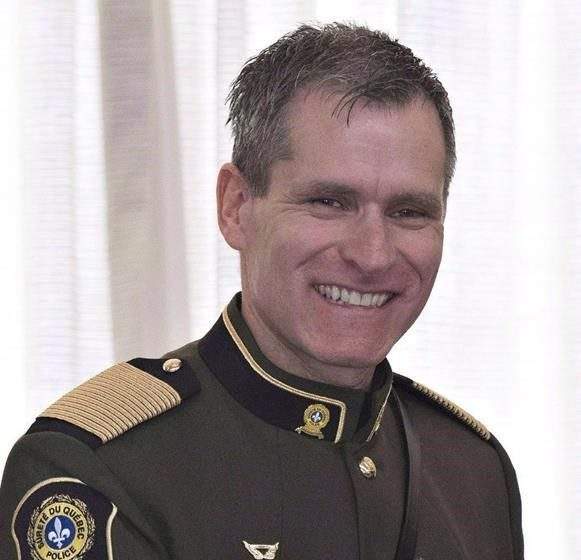 In this 2017 photo, Martin Prud'homme, smiles after he was decorated Officer of the Order of Merit of the Police Forces at Citadelle in Quebec City. Prud'homme announced his retirement after reaching a settlement with the Quebec government. Monday, Aug. 30, 2021.