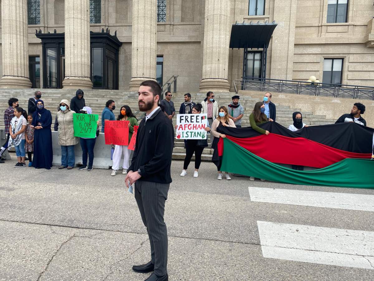 Bashir Faqiri looks on during a rally in Winnipeg to raise awareness about the crisis in Afghanistan Saturday.