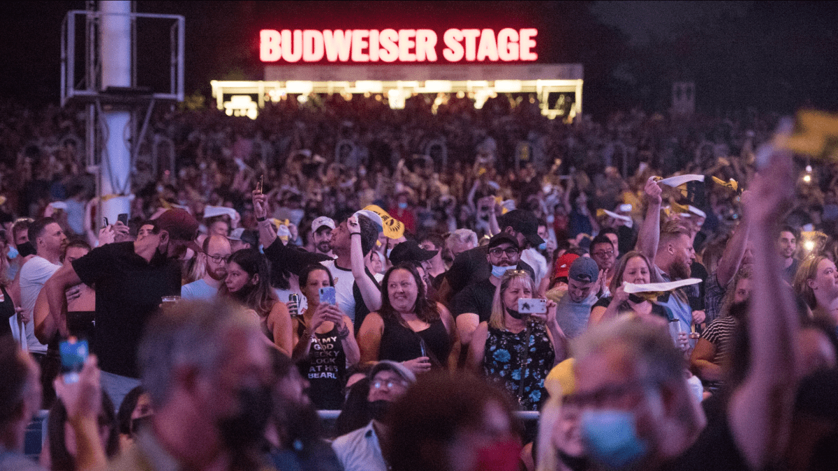 People cheer the Arkells on stage during their first live performance since the pandemic restrictions lifted, at the Budweiser Stage in Toronto on Friday, August 13, 2021. The concert marked the first live event for the band since the pandemic. 