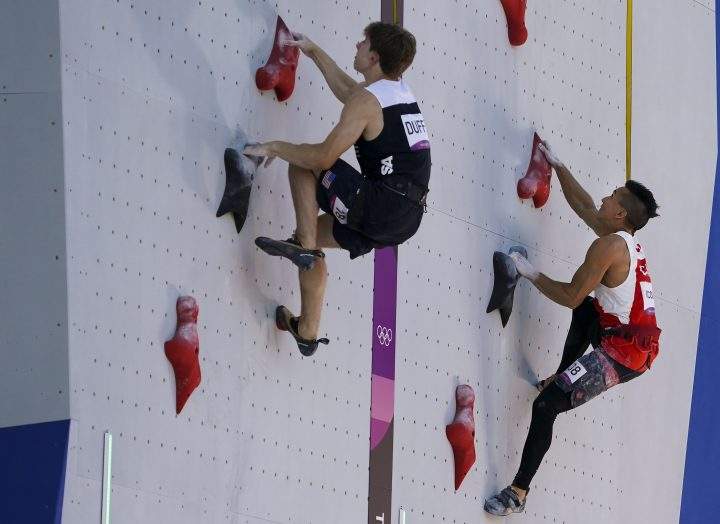 Sean McColl, right, of Canada competes against Colin Duffy of the United States in speed climbing at the men’s combined sport climbing event during the summer Tokyo Olympics on Tuesday, August 3, 2021.