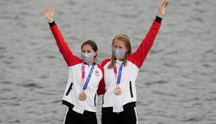 Laurence Vincent-Lapointe and Katie Vincent, of Canada, stand on the podium with their bronze medals after finishing third in the women’s canoe double 500m final A at the 2020 Summer Olympics, Saturday, Aug. 7, 2021, in Tokyo, Japan.