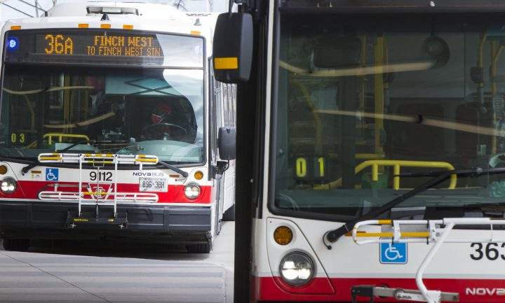 A TTC bus driver wearing a face mask is seen on a bus in Toronto on Sept. 17, 2020.