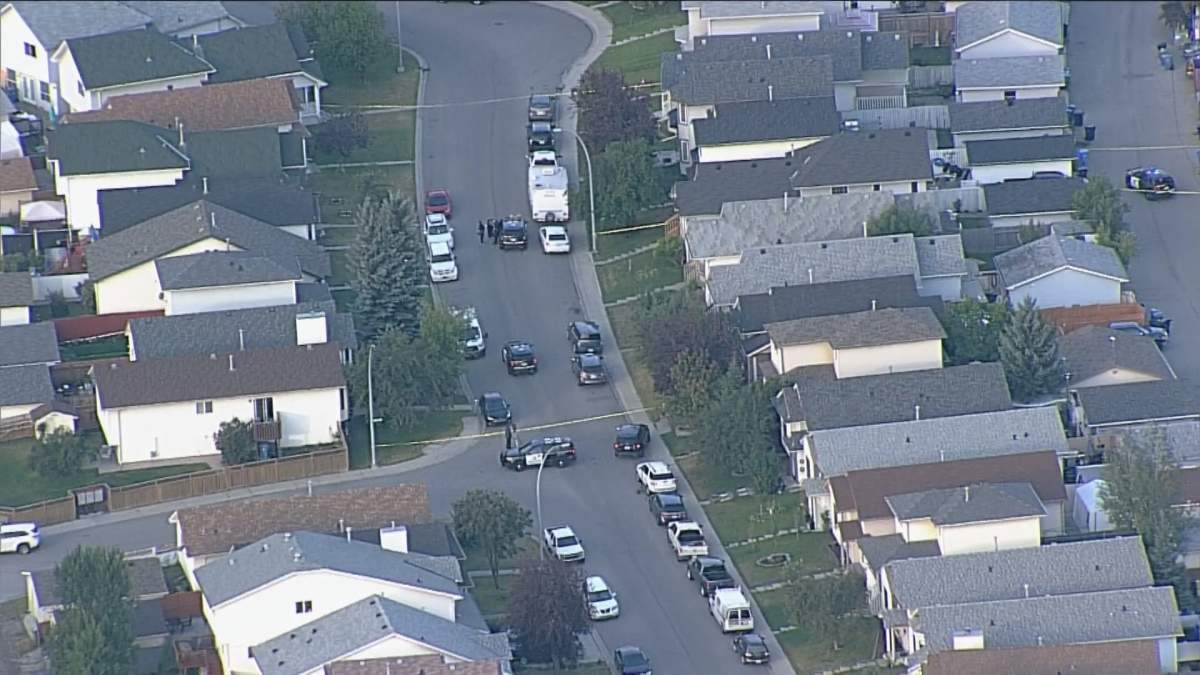 Calgary police on the scene of a homicide investigation in Erin Woods.